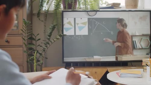 Student Takes Notes During Remote Online Math Lesson