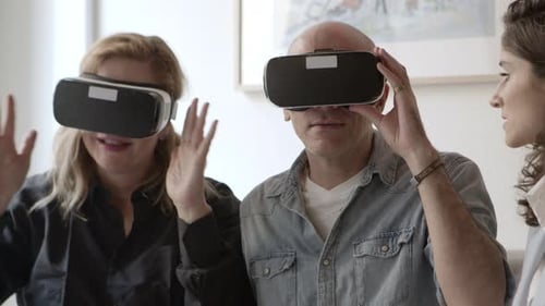 Closeup Shot of Excited Mature People Testing VR Glasses