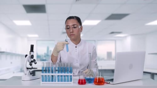 Young Adult Scientist Working in a Modern Lab