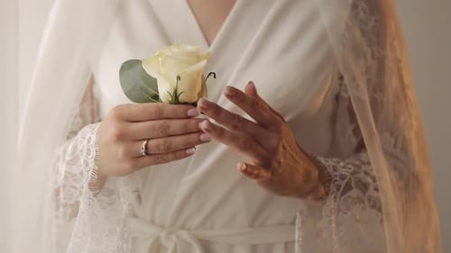 Woman Holding a Rose in Her Hands, Close-up