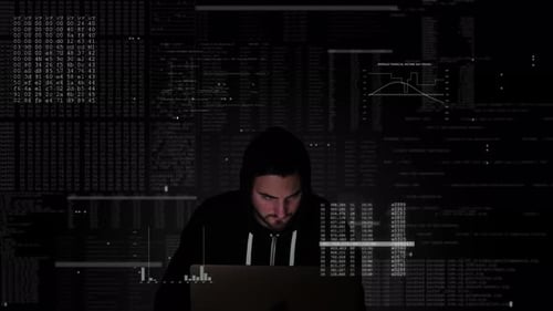 Hacker Working on Laptop Surrounded by Code