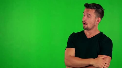 Young Handsome Caucasian Man Is Bored - Green Screen - Studio
