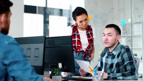 Team Collaborates on Project in Modern Office