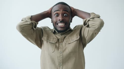 Man Reacts in Shock Then Transitions to Joy