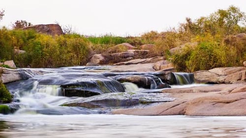 Wild Mountain River Flowing with Stone Boulders and Stone Rapids
