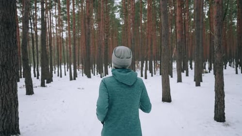 Back View Athlete Jogging in Winter