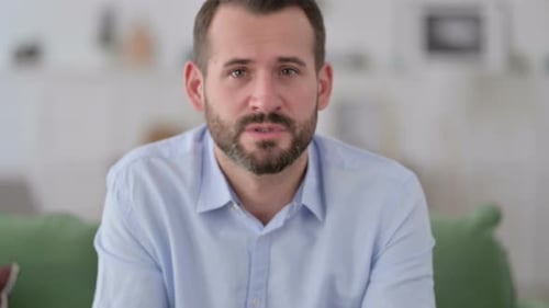 Webcam View of Video Chat By Young Man at Home