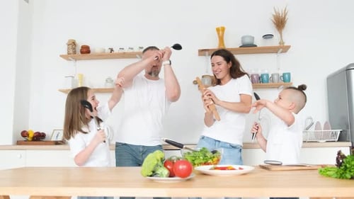 Happy Family Singing and Dancing in the Kitchen