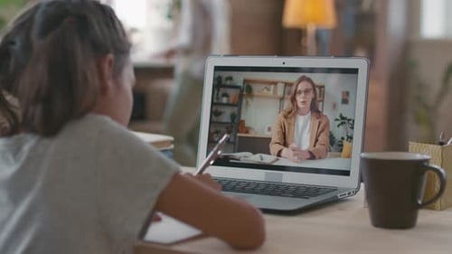 Girl Doing Online Lesson with Teacher on Laptop