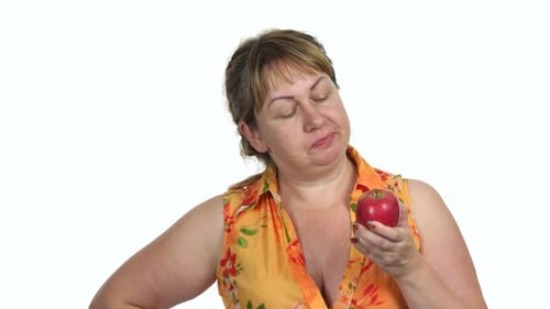 Woman Eating a Red Apple Close Up