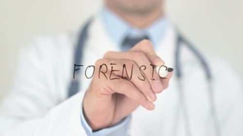 Doctor Writing the Word Forensics on Clear Surface