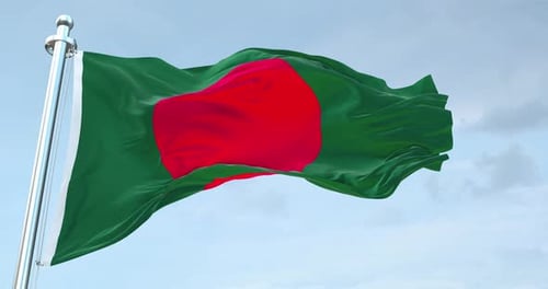 Waving Flag of Bangladesh Against a Cloudy Sky