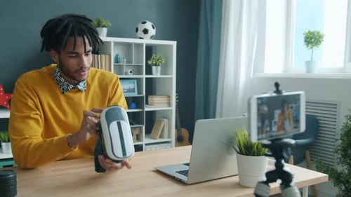 Young Man Reviewing VR Headset for his Vlog