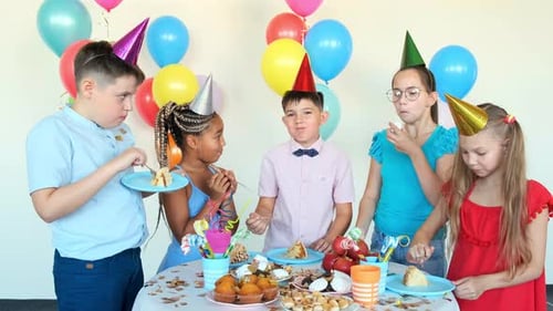 Children Eat Tasty Snacks Celebrating Birthday at Table