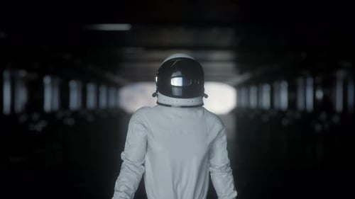 Astronaut Walks into Dark Tunnel Ready for Space Exploration