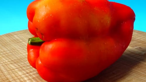 Fresh Red Bell Pepper on Cutting Board