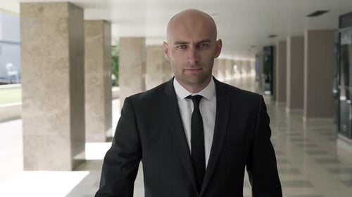 Confident Professional Office Worker Walking Through Passage