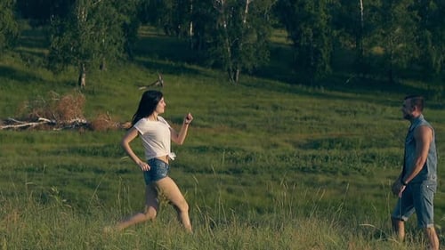 Woman Runs to Embrace Her Partner in Nature