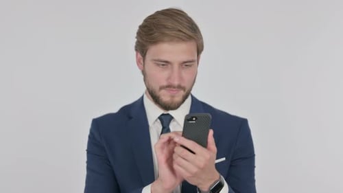 Young Adult Man Using a Mobile Phone