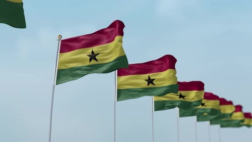 Waving Ghanaian Flags Against a Clear Blue Sky