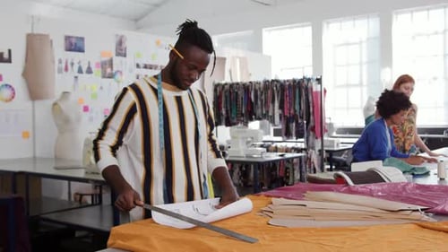Mixed race man working in creative office