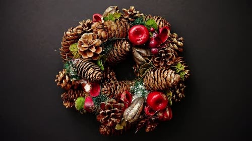 Festive Holiday Wreath Rotating on Black Background