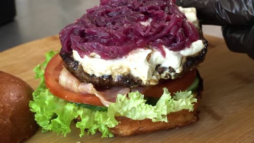 Burger Preparation with Fresh Ingredients and Tasty Toppings