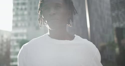 Portrait Young African American Man Standing Near the Office Building and Looking at Camera