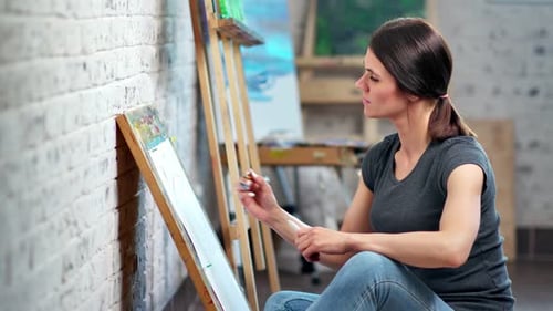 Woman Painting on Canvas in Art Studio