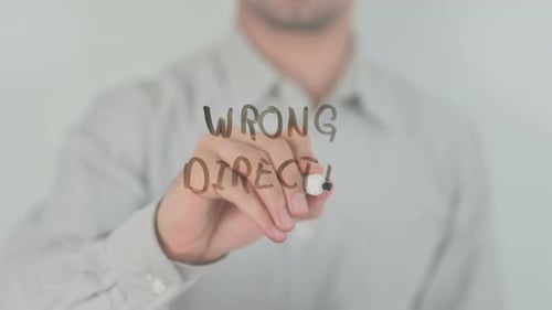Wrong Direction Writing on Screen with Hand