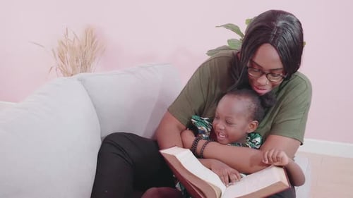Mother and Child Read a Book Together
