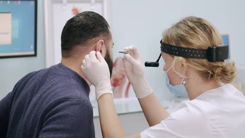 Doctor Examines Patient in Office