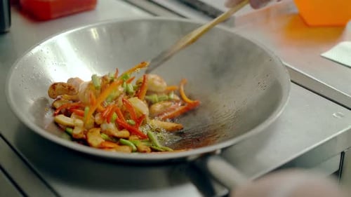 Chef Cooking Stir Fry in a Wok