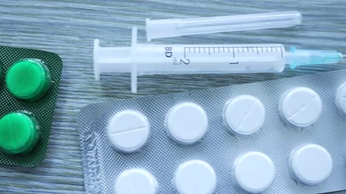 Close up of Medicine and Hypodermic Needle