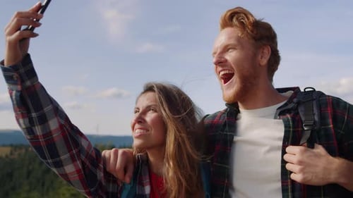 Couple Taking Mountain Top Selfies Together