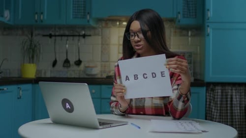Woman Teaching Online Class in Kitchen