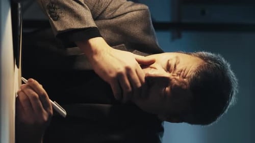 Man Drawing on White Board in Portrait Orientation