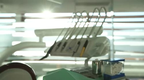 Bright Dental Room with Empty Chair and Tools