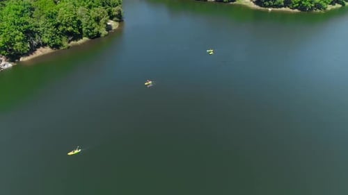 Friends Enjoying Riding Canoe On River