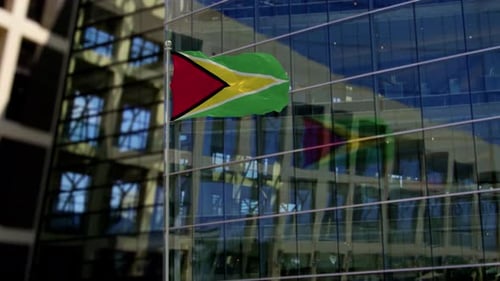 Guyana Flag Waving On A Skyscraper Building