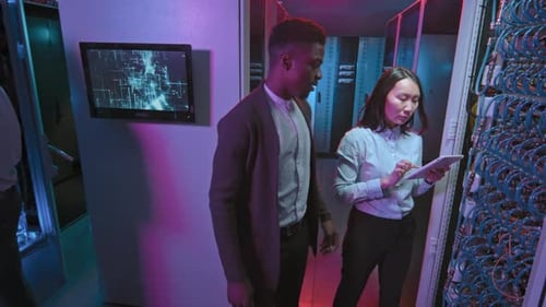 Slowmo of Technicians Working in Data Center