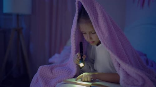Little Girl Child Reads Book Bedroom Bed With Flashlight Blanket Night