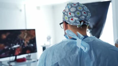 Doctor treating in operation room. Surgeon during operation process in surgery