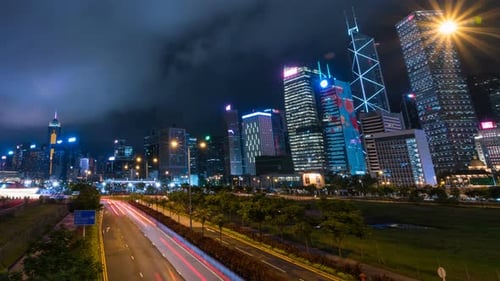 Night Cityscape with Modern Skyscrapers and Road