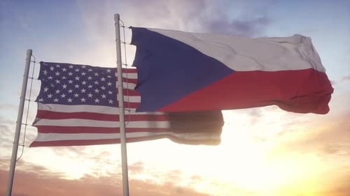 Waving American and Czech Flags Over Sunset Sky