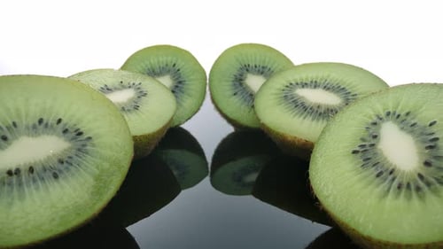 Fresh Kiwi Fruit Close Up on Black Surface