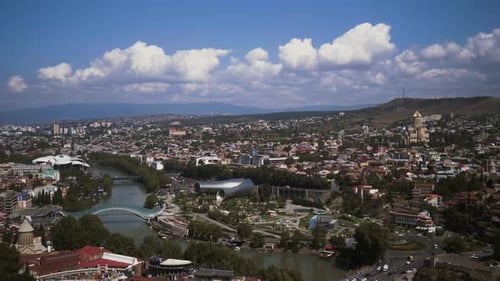 Tbilisi, Georgia. Top View Of Famous Landmarks In Summer Evening. Georgian Capital Skyline Cityscape