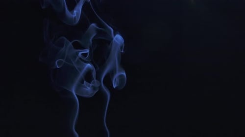 Blue Smoke Swirls Against Black Backdrop