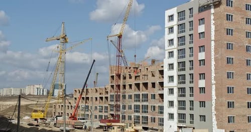 Builders Build A Brick House. Giant Cranes Are Working