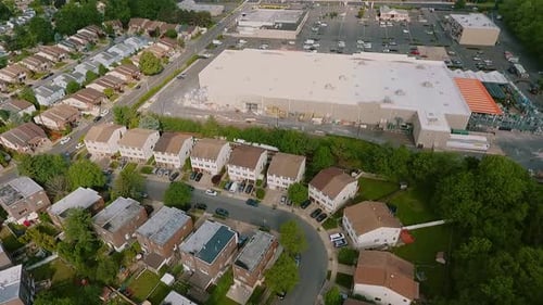 Aerial View Establishing Shot of American Neighborhood,, Suburb and Logistics Center with Warehouse
